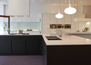 An image of a kitchen featuring a sink and counter top.