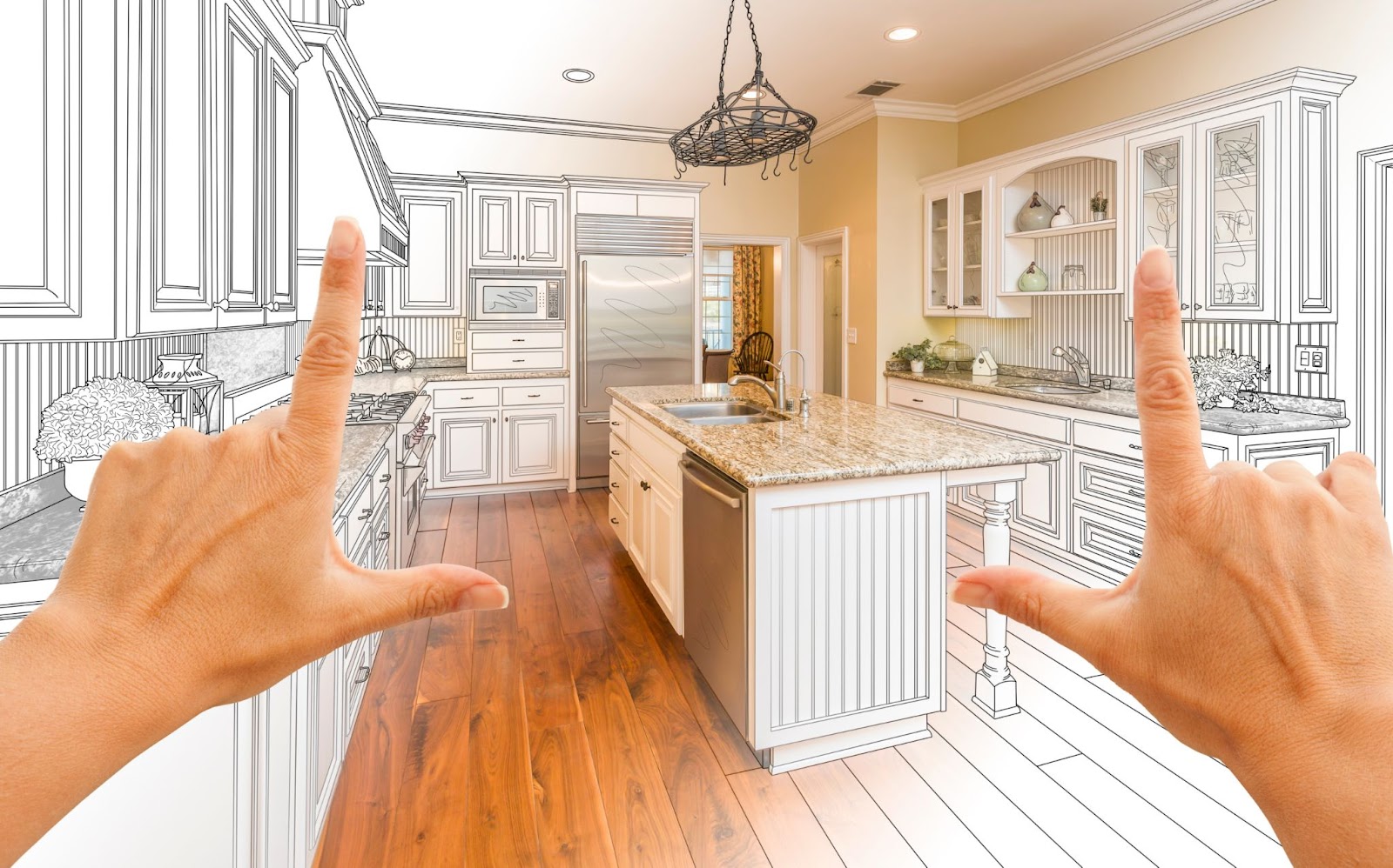 Hands framing a modern kitchen with white cabinets, granite countertop, and wooden floor, overlaid with a sketch design.